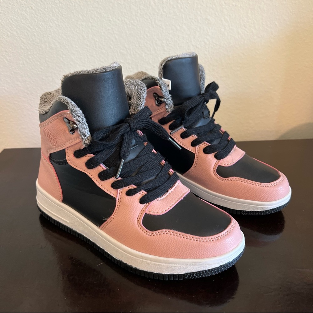 Woman’s Pink and Black High-Top Sneakers